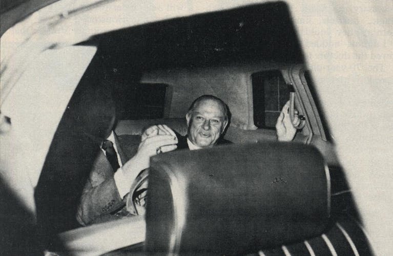 Summa counsel Chester Davis in the back seat of a car, taken from outside of the passenger window. 