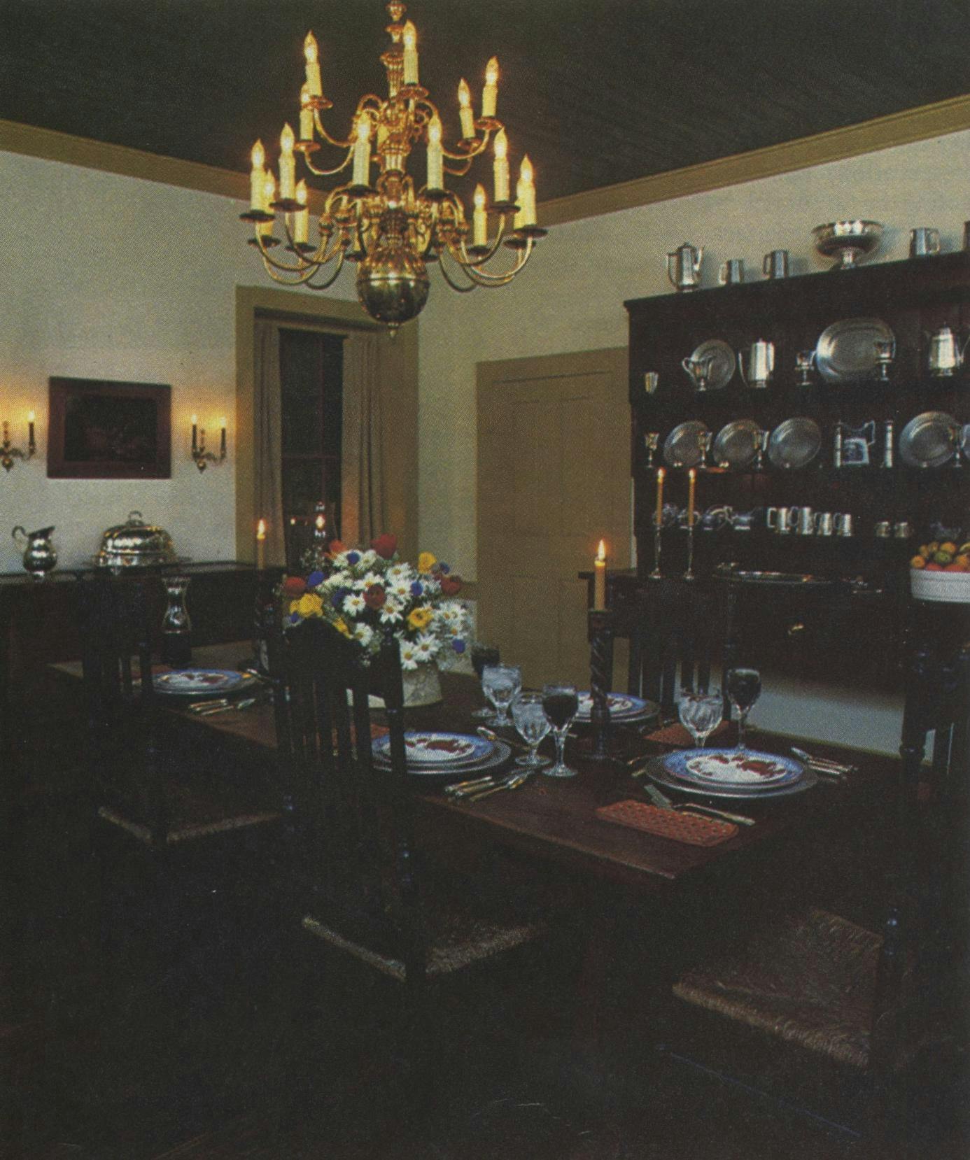 The formal dining room houses a wealth of collectibles, like an early-nineteenth-century brass chandelier from Philadelphia and a late-eighteenth-century Welsh dresser.