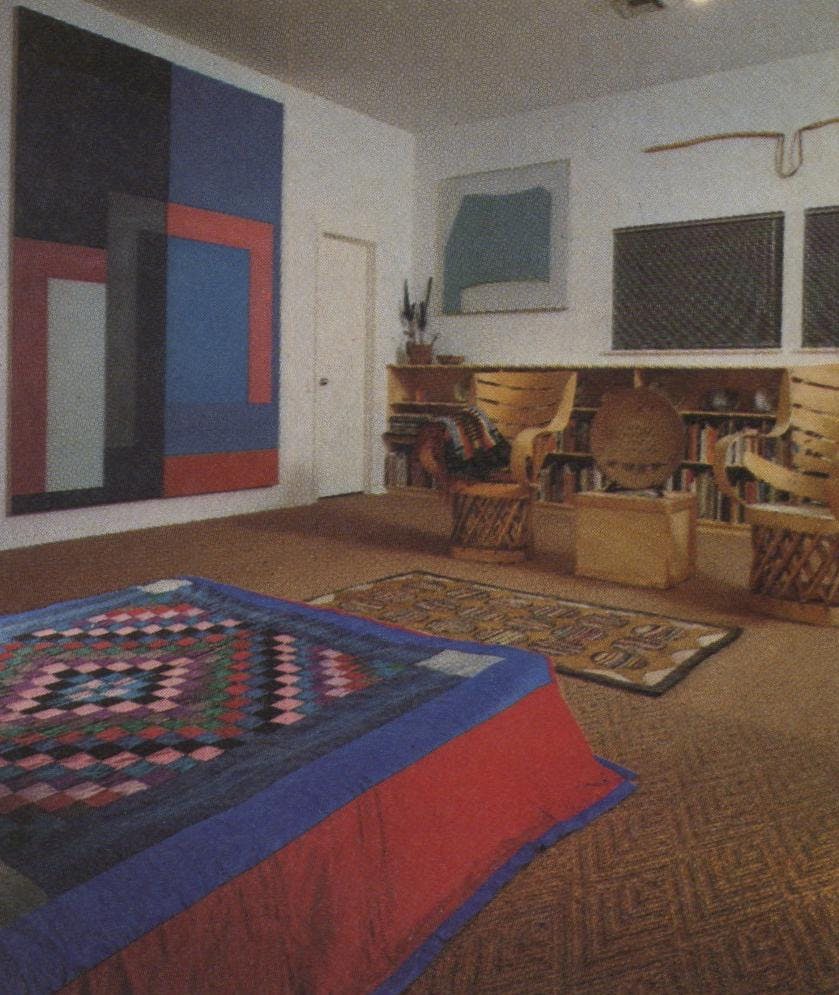 David Novros’ large canvas repeats the colors of the Amish quilt on the bed. The Mimbres and Sikyatki American Indian pottery on the first row of shelves date to 1300, but Peter Voulkos’ 1973 plate is a perfect complement. Above the shelves is Gary Stephan’s “Garden Cycle 5.” The American hooked rug dates from the 19th century. Above the windows is a rope and twine creation by Chuck Arnoldi.