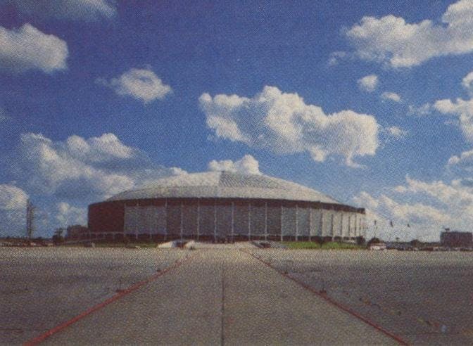 In a wasteland of parking lot, the Dome hunkers down like a squatty monolith.
