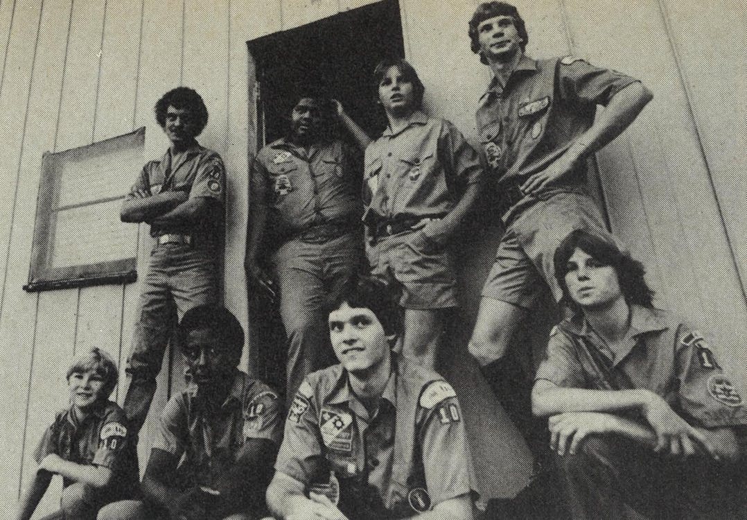 Photograph of a boy scout troop, eight boys in uniform. 