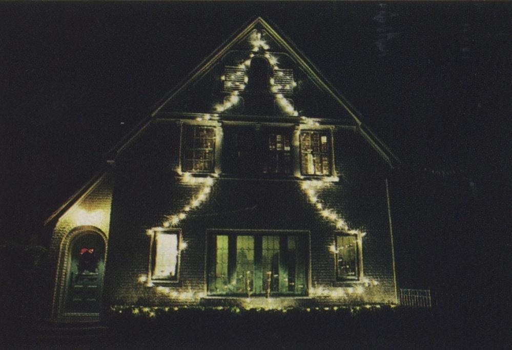 First, Nat Baker took a photo of his house in Highland Park, then he projected it onto paper and sketched the tree. Next, he put in screw eyes so he could easily attach the strings of lights. But for 1982 he’s going to have something different.