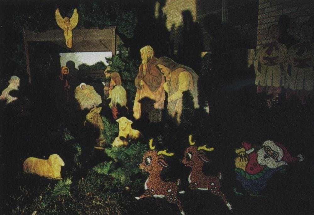 The Atamanczuks of Fort Worth put up their first decorations (manger and choirboys) 23 years ago. Ann Atamanczuk says their kind of display “makes people realize what Christmas is all about instead of running to the store.”