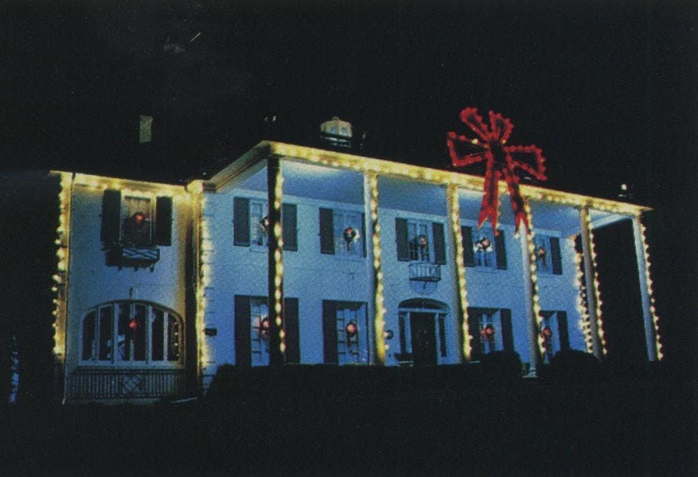 When you have a house with its own name and you want to decorate, you do it in a big way. Al Morgan spends $5000 every year on Belle Nora in Dallas. It takes five men three days to string the three thousand lights.