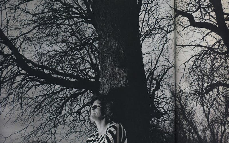 Brenda Rowland against a tree. 