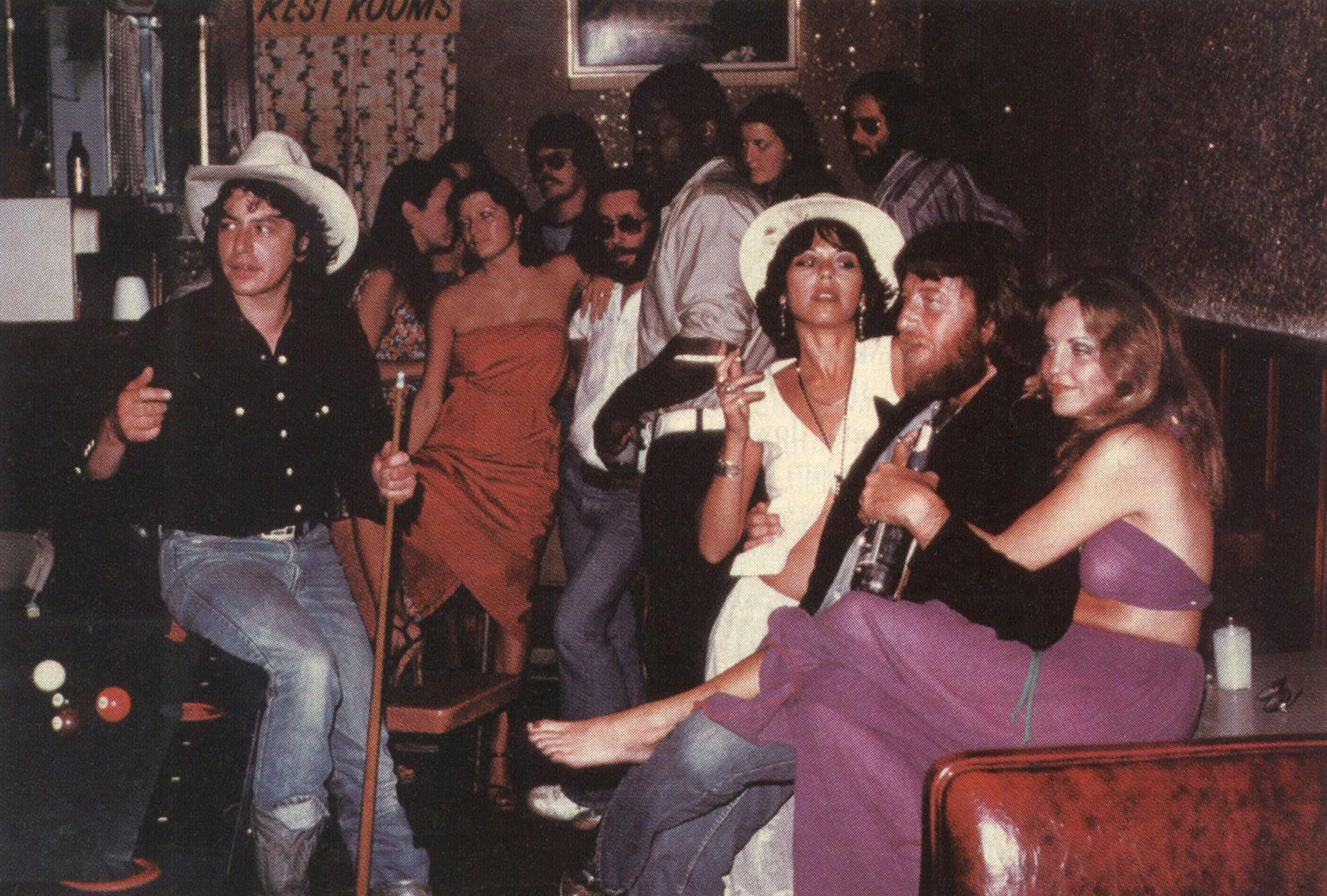 Mid-seventies: The Joe Ely Band hanging out with C. B. Stubblefield (center) at Stubb's Bar-B-Q. From left, Ely, steel guitarist Lloyd Maines (against the back wall), accordion player Ponty Bone, bassist Greg Wright (in the corner), guitarist Jesse Taylor. 