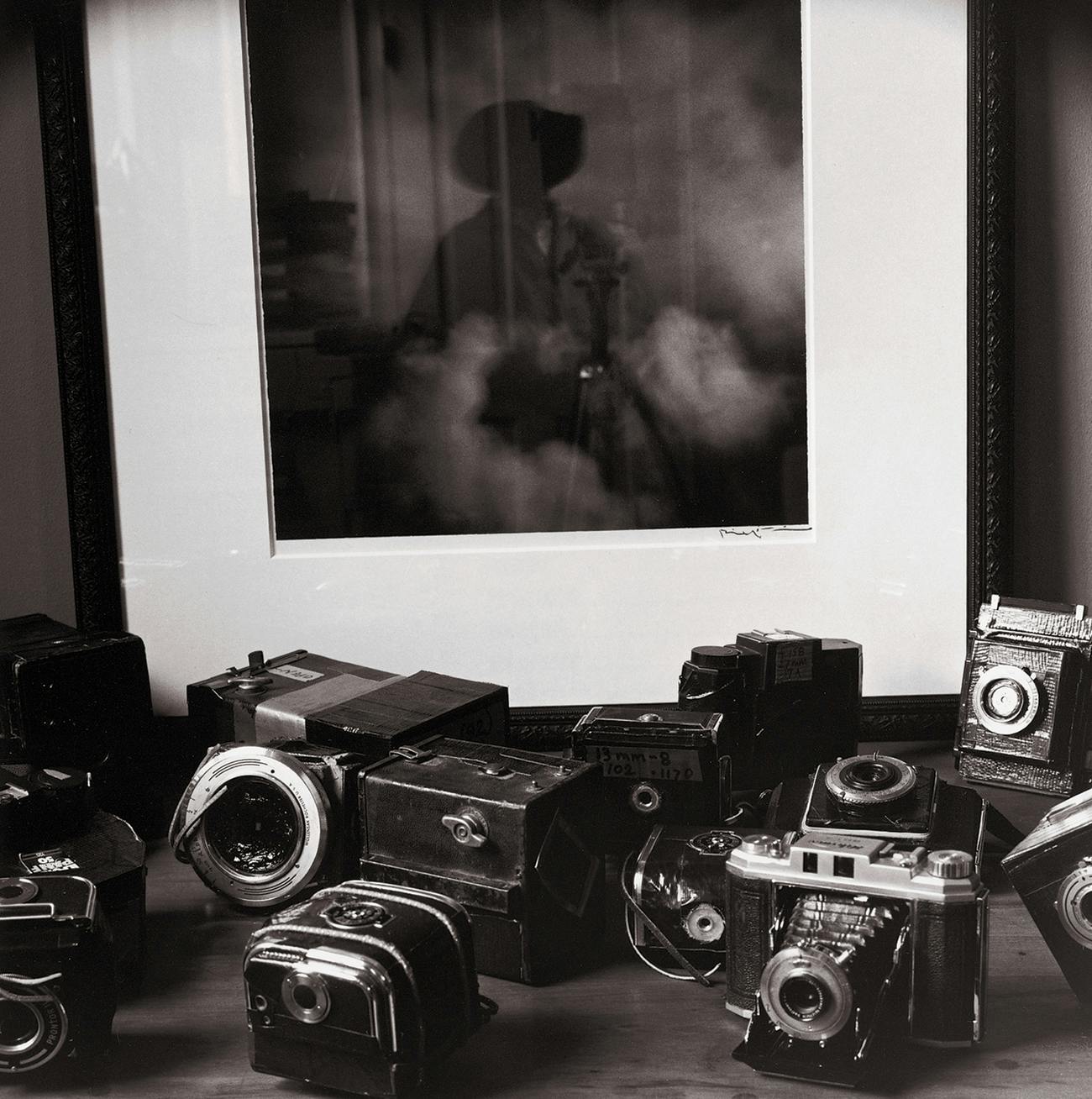 Wittliff rebuilt these cameras, replacing each lens with a pinhole punched in a piece of cheap pie pan; he calls the cameras tragaluces (“light swallowers”). Behind them is a tragaluz picture he took in Mexico titled Nubes ("Clouds"). "I was trying to find a way to see through my own eyes, and I'm kind of a retro guy, so I went back to one of the earliest forms of photography," he says. "It's just amazing what you can make a camera without a lens do."