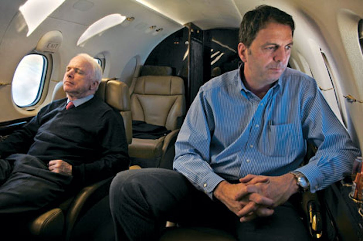 John Weaver sitting next to a sleeping John McCain on a private plane.