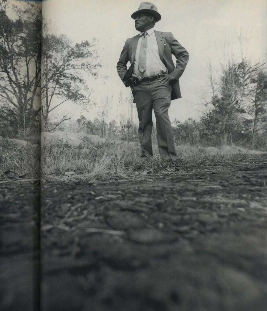 Lee Arthur Wilson stands where his cousin was left by the side of the road.