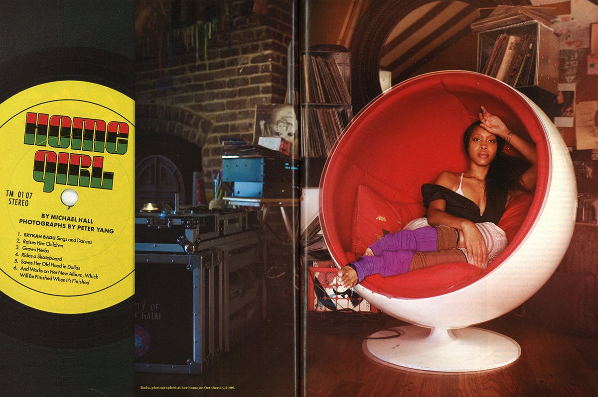 Erykah Badu in an egg chair next to a vinyl of her album Home Girl. 