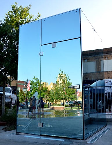 Exterior of the glass-walled toilet in Sulphur Springs is a one-sided mirror. 