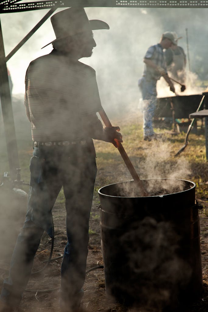 Stirring the beans in a 50 gallon cast-iron wash pot in Millheim