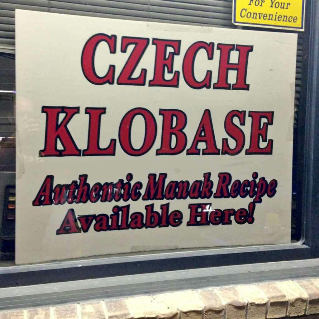 Sign reading, "Cxech Klobase: Authentic Manak recipe available here!"