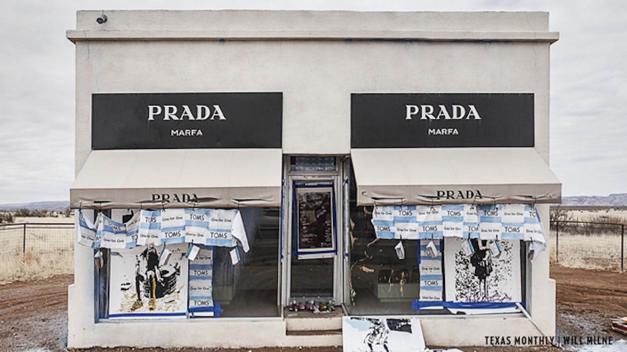 Prada Marfa vandalized with TOMS merchandise.