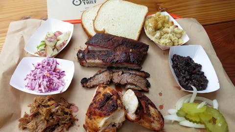 BBQ tray with meat, bread, and sides from horse thief BBQ. 