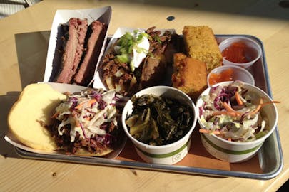 BBQ Tray with cole slaw, sauces, and greens from Morgans BBQ. 