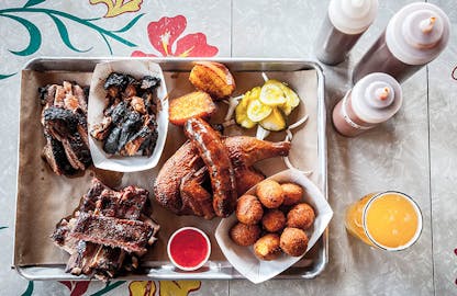 BBQ Tray with a chicken and hushpuppies from Salvage BBQ.