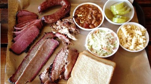 BBQ Tray with meat, bread, beans, cole slaw, mac and cheese, and pickles from Smoke City