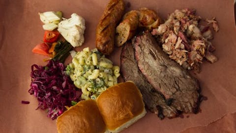BBQ Tray with rolls, macaroni salad, and purple cabbage from Smokestack BBQ