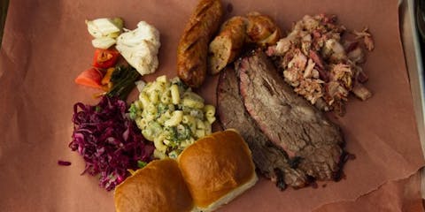 BBQ Tray with rolls, macaroni salad, and purple cabbage from Smokestack BBQ