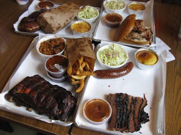 Four loaded BBQ Trays from Smoque