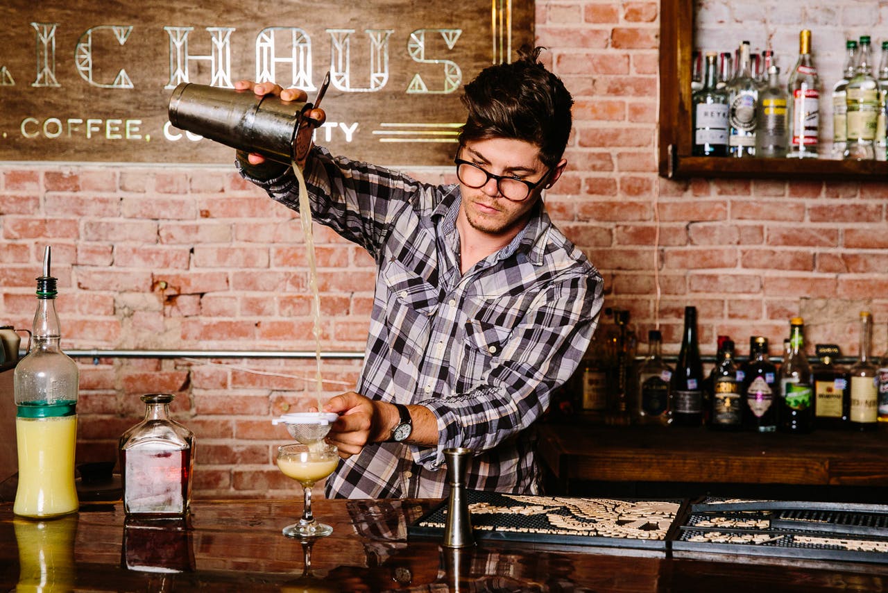 Bartender Logan Burkham pours a drink at Public-Haus.
