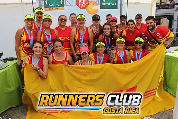 Youssef Khater appears in the back row (behind the woman in a red ball cap) of this group photo of a Costa Rican Runners Club.