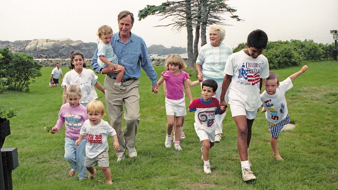In 1988, walking (second from right) with his famous family, including soon-to-be president George H.W. Bush and his wife, Barbara.
