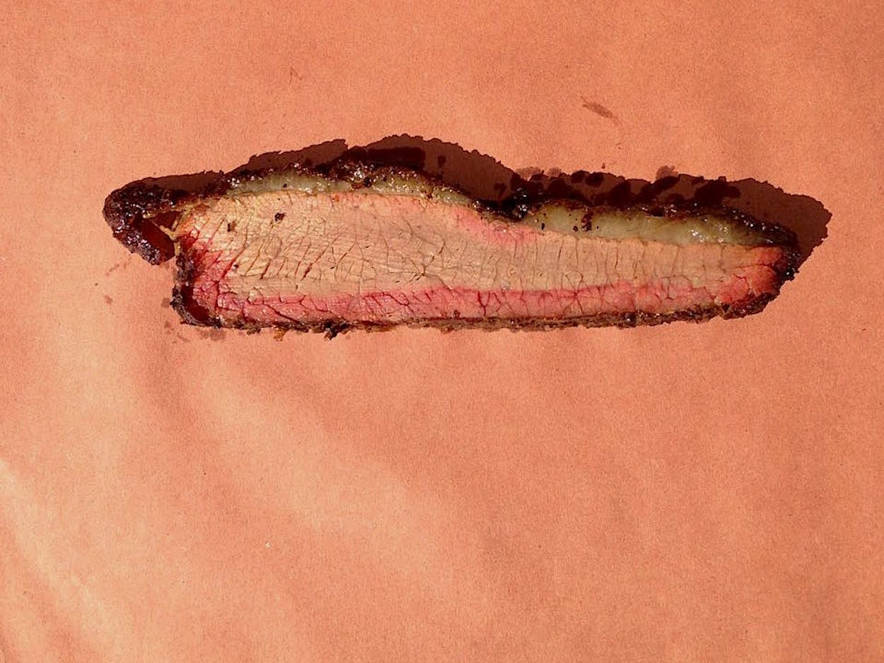Slice of brisket with a smoke ring.
