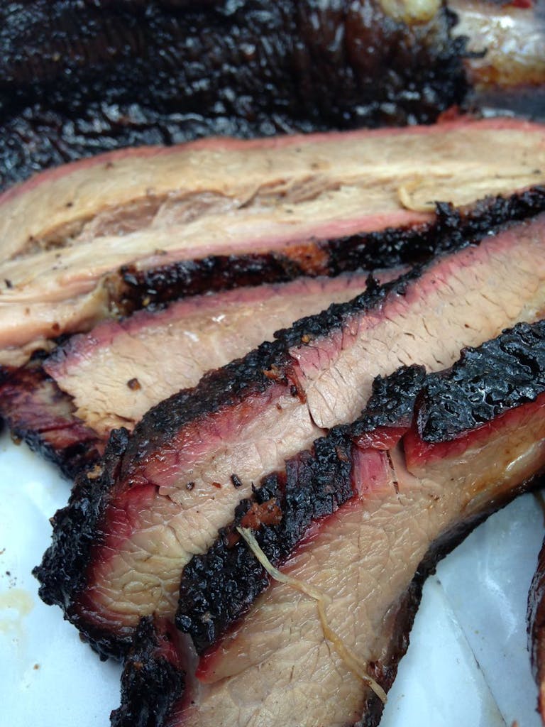 Brisket with a good crust and smoke ring. 