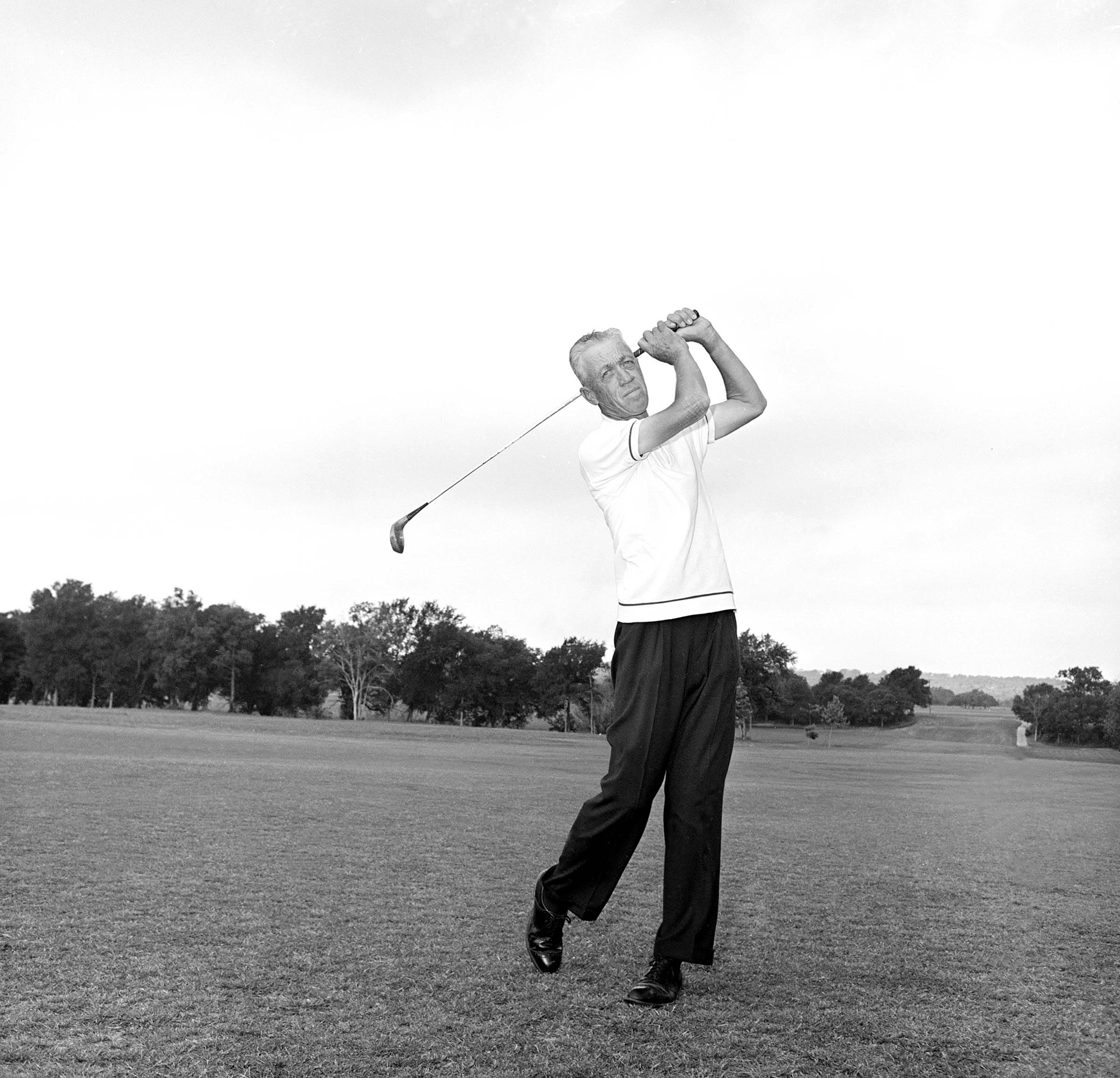 Pro golfer Harvey Penick shown during a posed swing at the Austin, Texas Country Club, May 2, 1964.