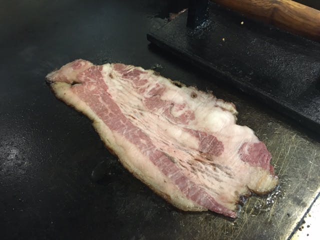 Beef bacon cooking. 