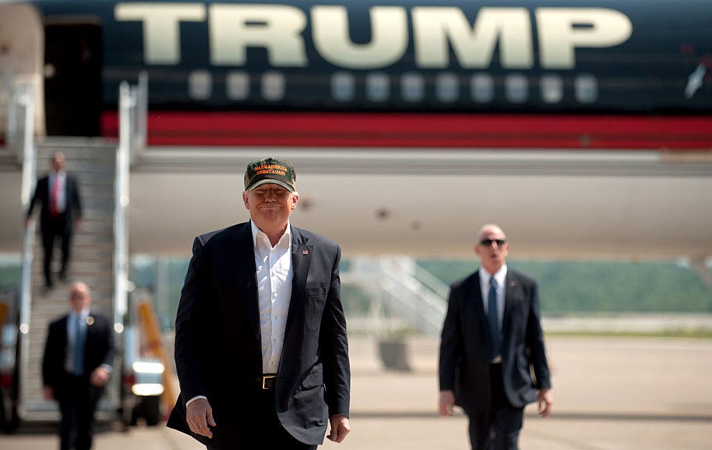 Donald Trump walks from his plane to speak to supporters at a rally at Atlantic Aviation on June 11, 2016 outside Pittsburgh, Pennsylvania.