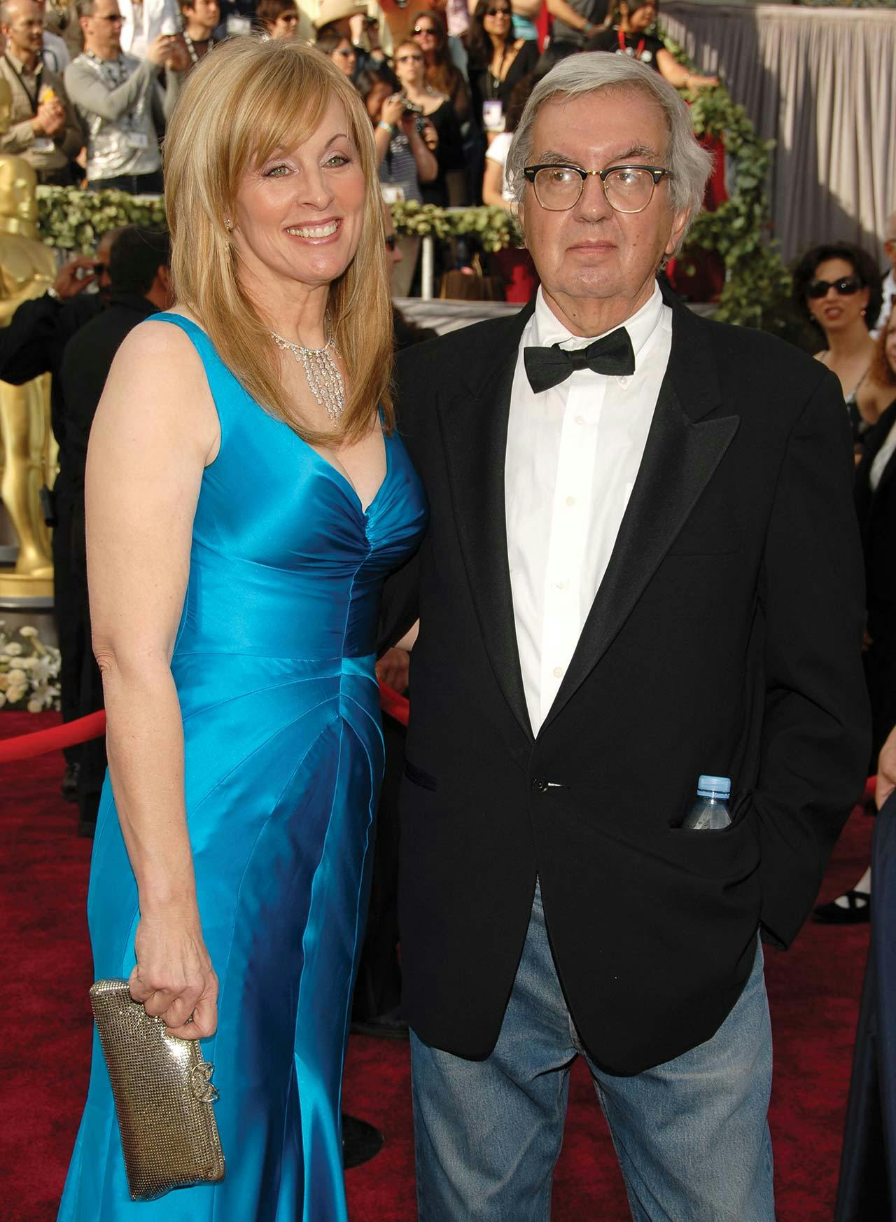Larry McMurtry in his late sixties, standing on the red carpet with Ossana at the 2006 Academy Awards.