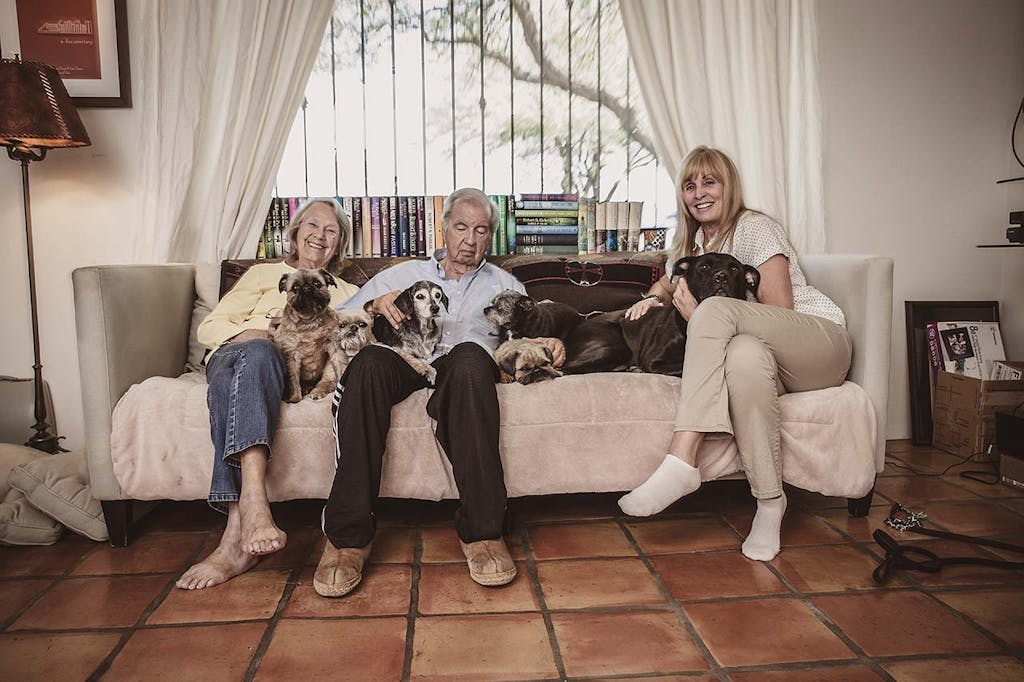 Larry McMurtry with his wife, Faye Kesey (left), and writing partner Ossana, as well as the six dogs with whom they share a home in Tucson.