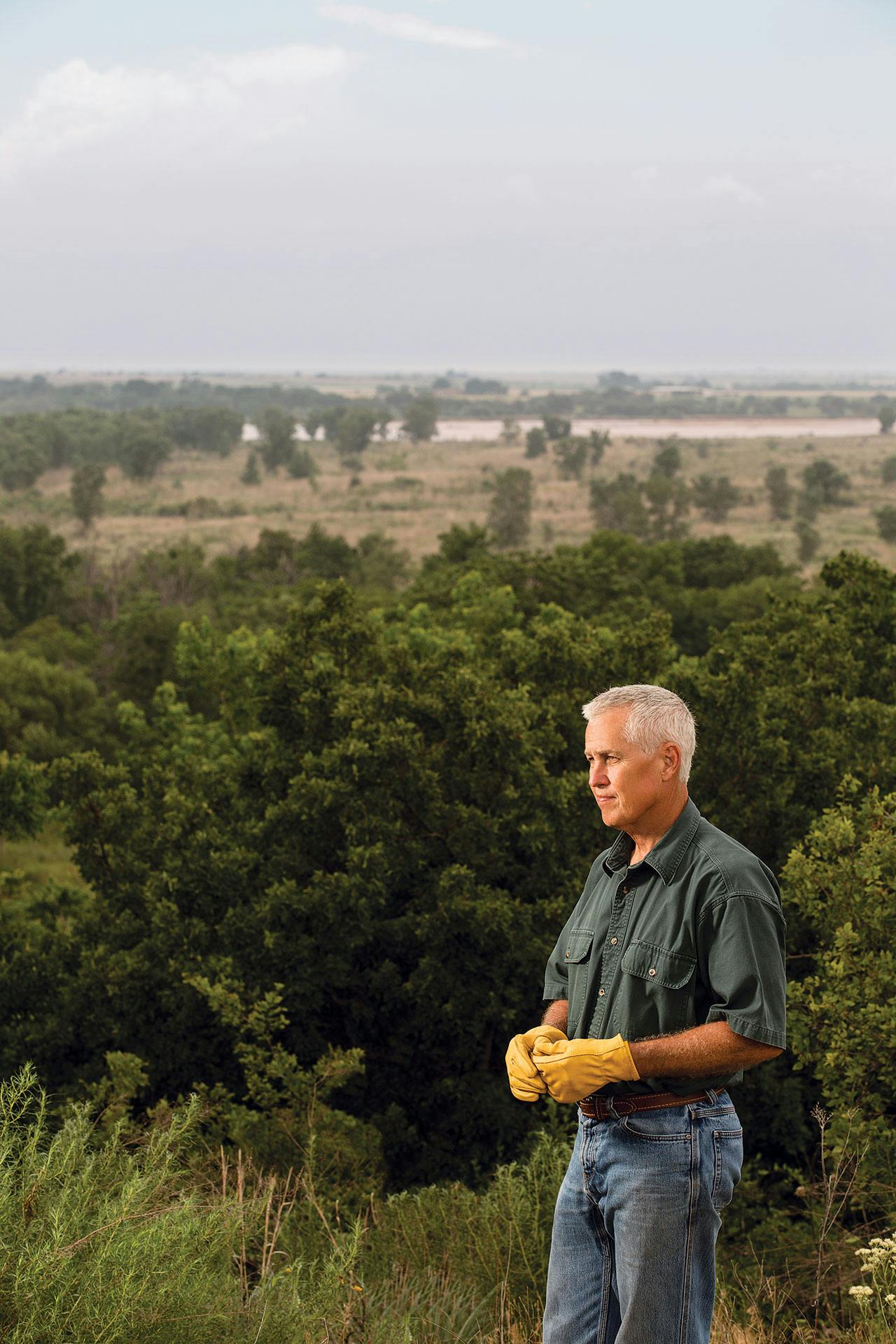 Canan on his North Texas property, with the Red River in the background, on May 26, 2016. 