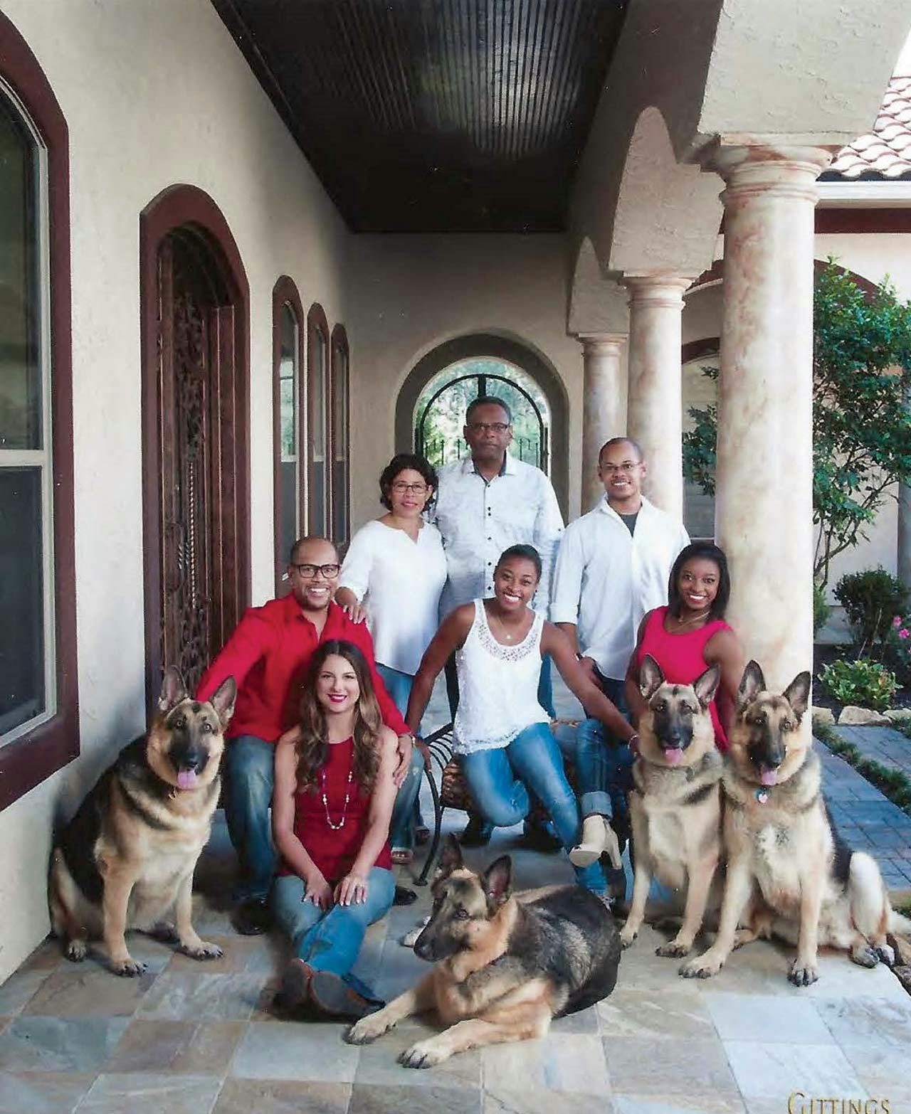 The Biles family at Ron and Nellie's home, including four German Shepards. 
