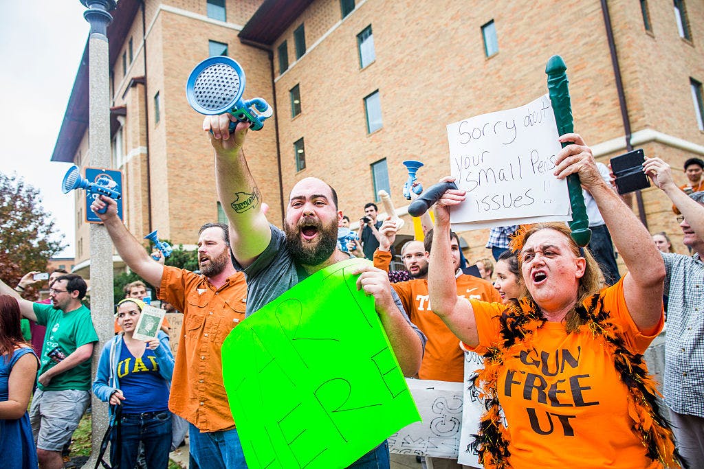 Gun activists march close to The University of Texas campus in Austin, Texas December 12, 2015. In addition to holding a demonstration for open carry, the group also staged a mass shooting.