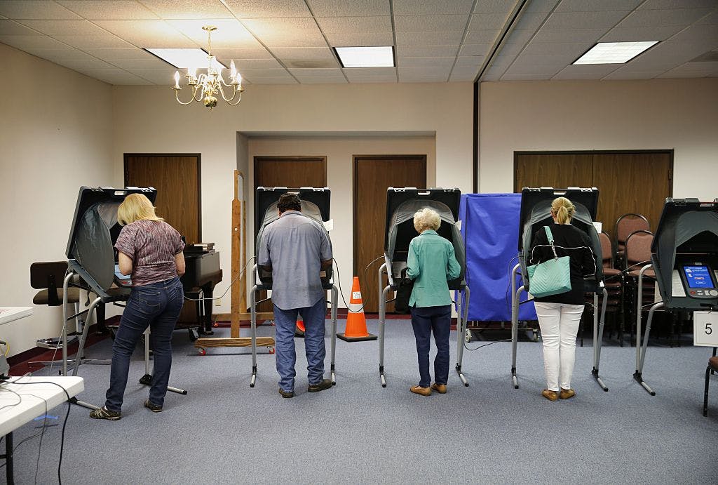 Voters cast their ballots inside Calvary Baptist Church March 1, 2016 March 1, 2016 in Rosenberg, Texas.