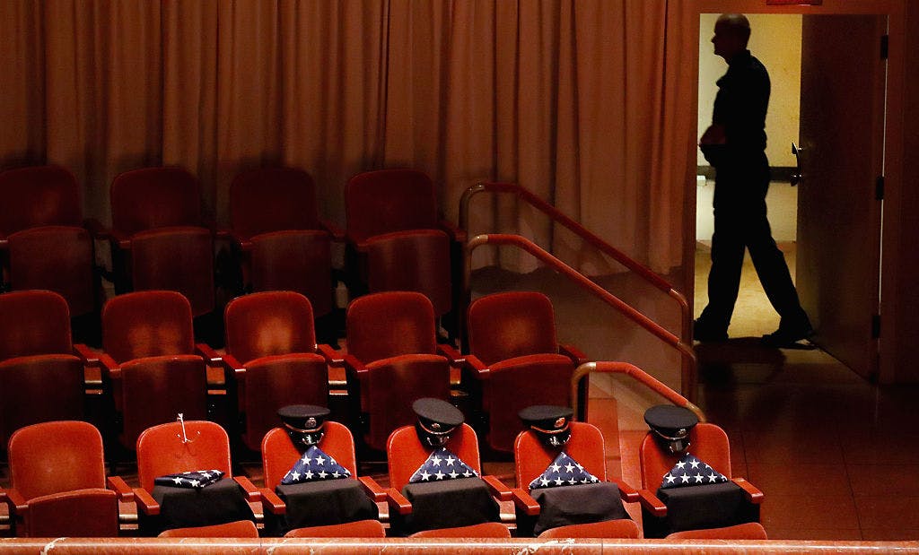 Five reserved seats sat empty, honoring five slain Dallas police officers during an interfaith memorial service at the Morton H. Meyerson Symphony Center on July 12, 2016 in Dallas, Texas. 