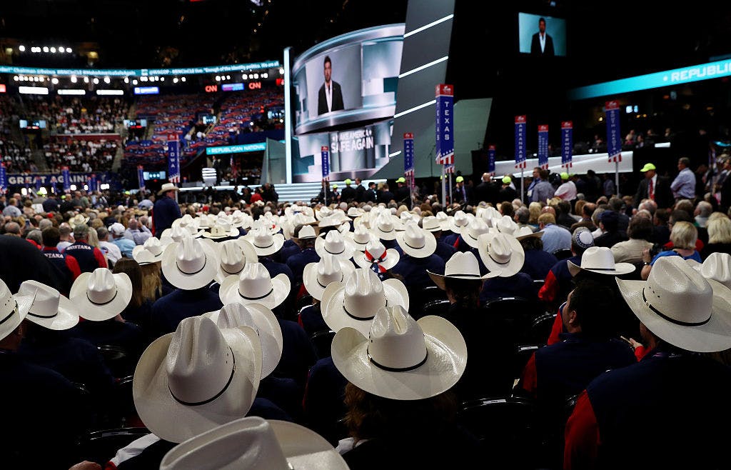 Texas delegates listen to former Navy SEAL Marcus Luttrell deliver a speech on the first day of the Republican National Convention on July 18, 2016 at the Quicken Loans Arena in Cleveland, Ohio. 
