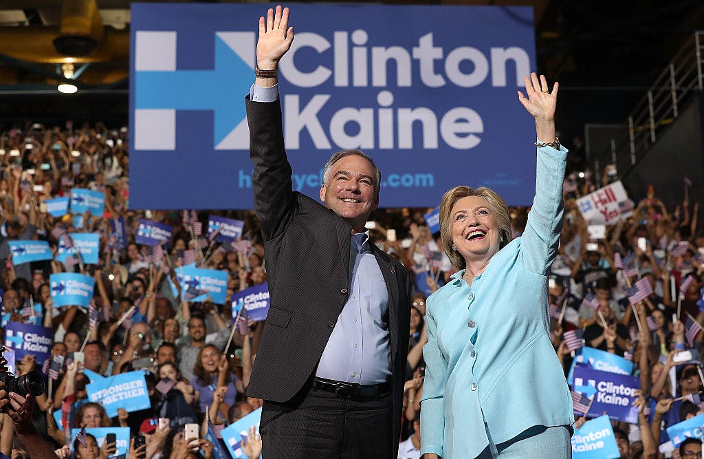 MIAMI, FL - JULY 23: Democratic presidential candidate former Secretary of State Hillary Clinton and Democratic vice presidential candidate U.S. Sen. Tim Kaine (D-VA) greet supporters during a campaign rally at Florida International University Panther Arena on July 23, 2016 in Miami, Florida.