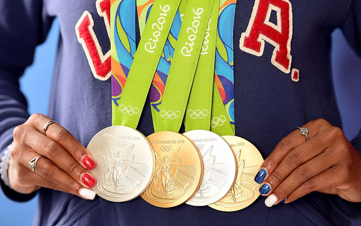 Sporting medals. Олимпийские медали 2022. Олимпийская медаль 2000. Медали олимпиады в Сиднее. Олимпийские медали Сидней 2000.