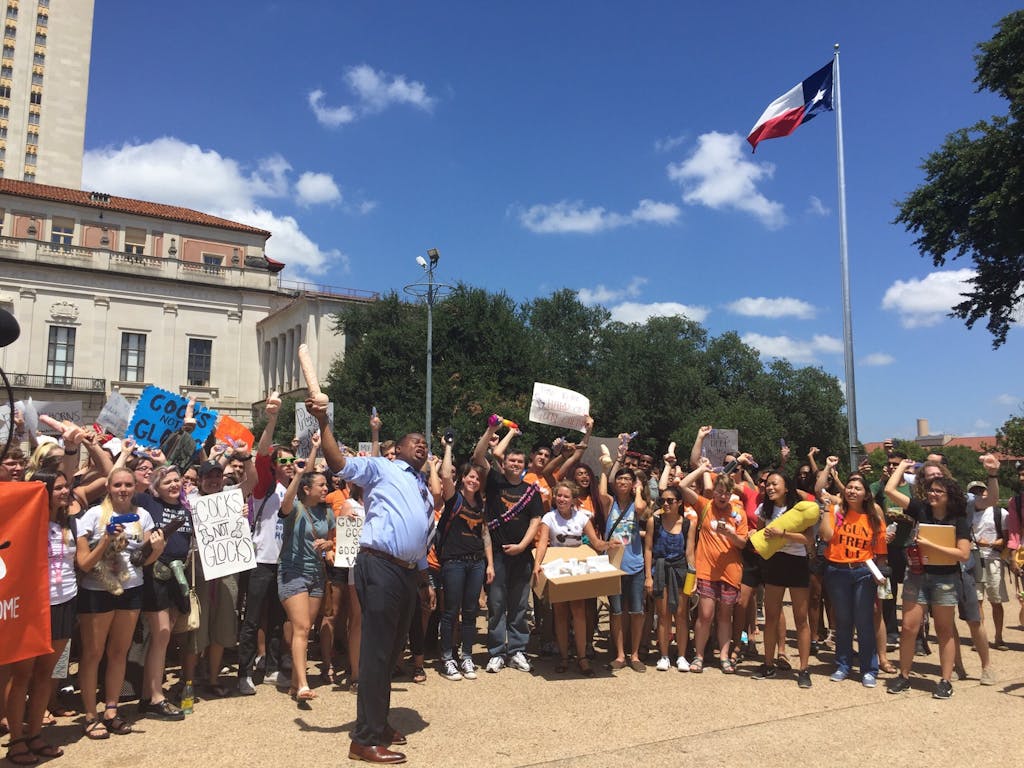 Roy Wood Jr. from the Daily Show with Trevor Noah leads University of Texas at Austin Students in a "Cocks Not Glocks" chant on August 24, 2016.