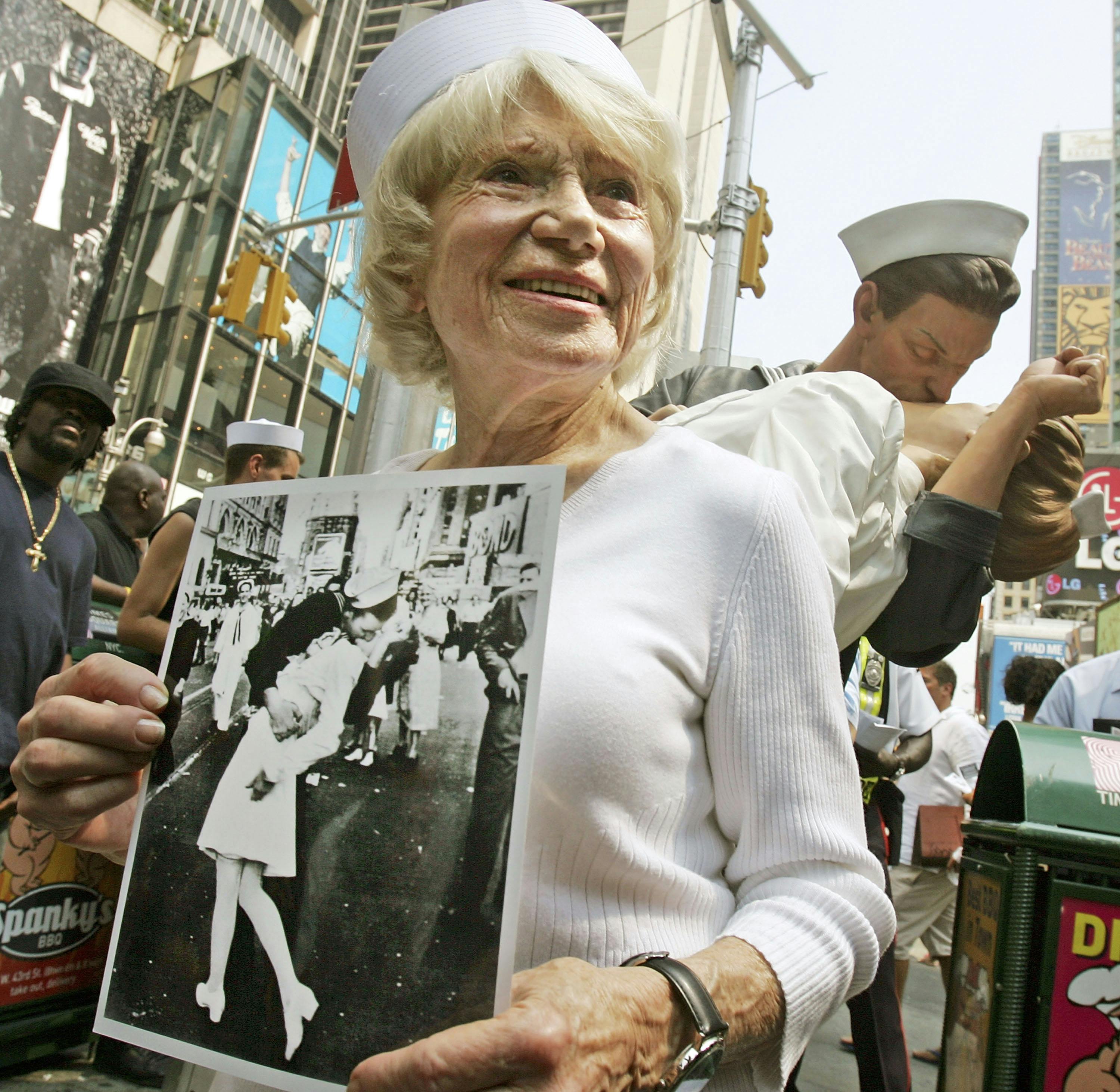 Eighty six-year-old Edith Shain stands in Times Square in front of a statue of her famous kiss with a sailor on V-J Day at the end of World War II August 11, 2005 in New York City. The famous kiss was photographed by Alfred Eisenstaedt and the unveiling of the statue coincides with the 60th anniversary of the end of World War II on August 14, 1945. The sailor in the photograph has never been positively identified. 