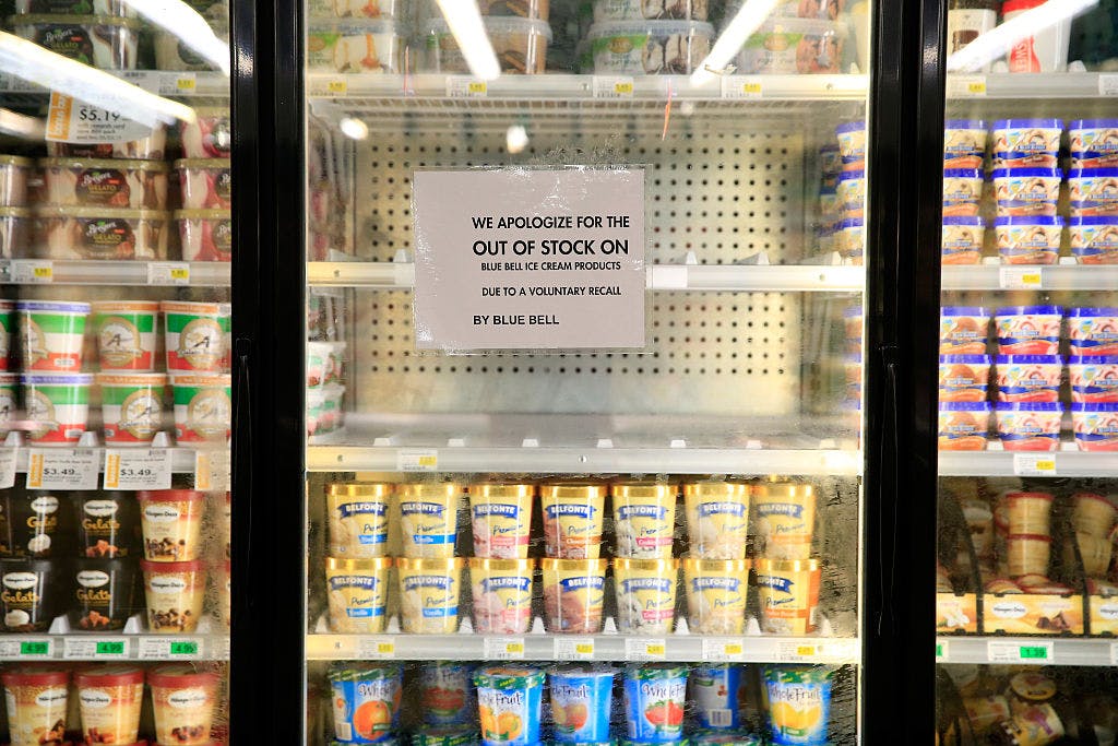 Shelves are bare and signs are posted where Blue Bell products were displayed in a grocery store on April 21, 2015 in Overland Park, Kansas.