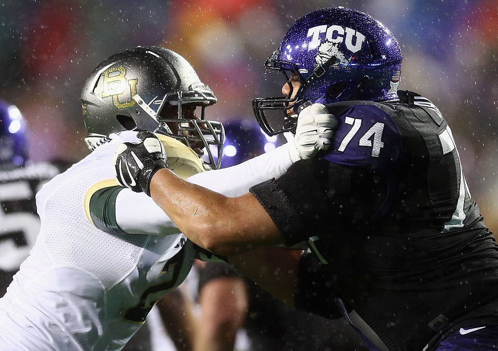 FORT WORTH, TX - NOVEMBER 27: (L-R) Shawn Oakman #2 of the Baylor Bears and Halapoulivaati Vaitai #74 of the TCU Horned Frogs during the second quarter at Amon G. Carter Stadium on November 27, 2015 in Fort Worth, Texas. 