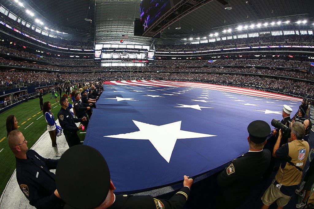 ARLINGTON, TX - SEPTEMBER 11: A general view of a giant American flag held on the field during pre-game ceremonies prior to the game between the Dallas Cowboys and New York Giants before at AT&T Stadium on September 11, 2016 in Arlington, Texas.