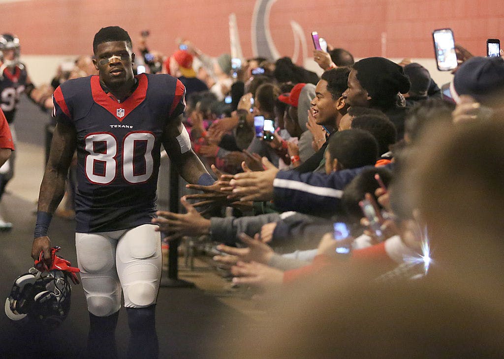 Andre Johnson #80 of the Houston Texans shakes hands with fans before playing the Jacksonville Jaguars in a NFL game on December 28, 2014 at NRG Stadium in Houston, Texas. 