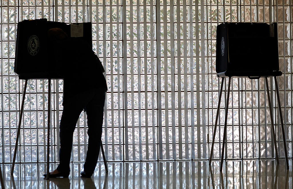A voter casts her ballot on November 6, 2012 in Mansfield, Texas.